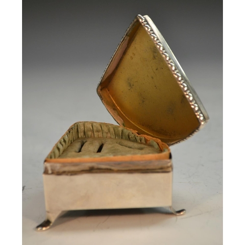 886 - An unusual Edwardian silver segment shaped dressing table ring box, hinged cover enclosing provision... 