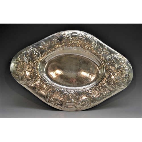 900 - Gilbert Marks - a large Arts and Crafts Britannia silver navette shaped table centre dish, planished... 