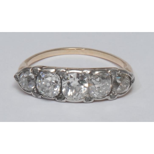 997 - A Victorian diamond quintet line ring, liner set with five graduated old irregular cushion cut diamo... 