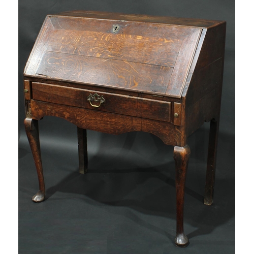 1372 - A George II oak bureau, the fall front with fitted interior, over one long drawer, cabriole  foreleg... 