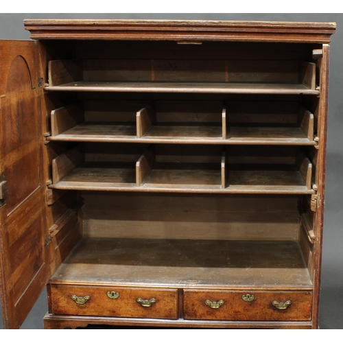 1446 - A 'George III' oak low press/housekeeper's cupboard, moulded cornice above a pair of raised and fiel... 