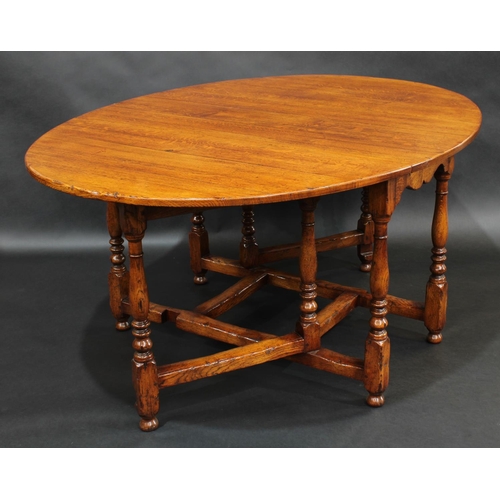 2066 - Arighi Bianchi - an oak gateleg dining table, in the 17th century taste, oval top with fall leaves, ... 