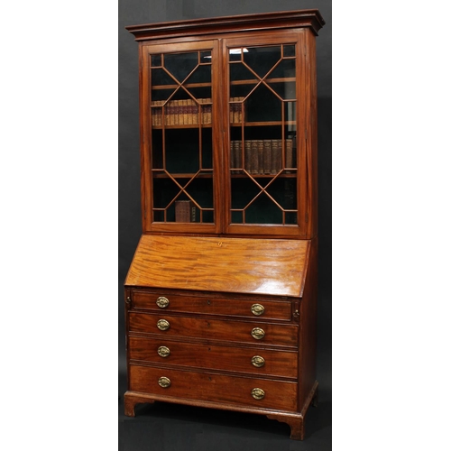 2067 - A George III mahogany bureau bookcase, stepped cornice above a pair of astragal glazed doors, fall f... 