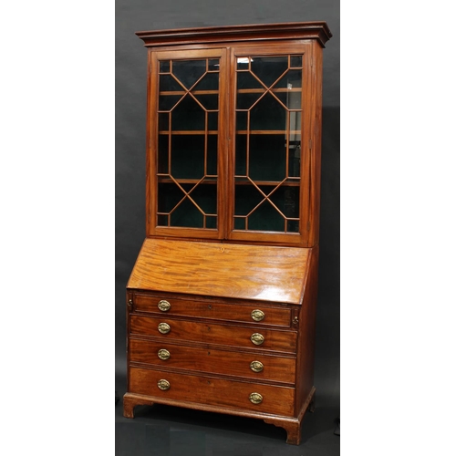 2067 - A George III mahogany bureau bookcase, stepped cornice above a pair of astragal glazed doors, fall f... 