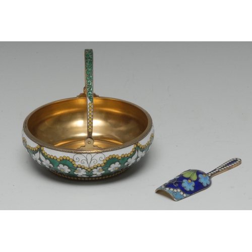 689 - A Russian silver-gilt and cloisonné enamel swing handled basket, decorated in tones of green, white,... 