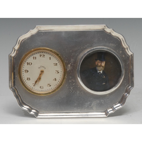 833 - A George V combination shaped rectangular easel timepiece/photograph frame, circular apertures, the ... 