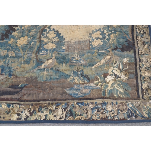 1287 - A 17th century French tapestry, the friezes worked in the baroque manner with verdure of scrolling f... 