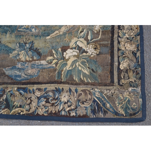 1287 - A 17th century French tapestry, the friezes worked in the baroque manner with verdure of scrolling f... 