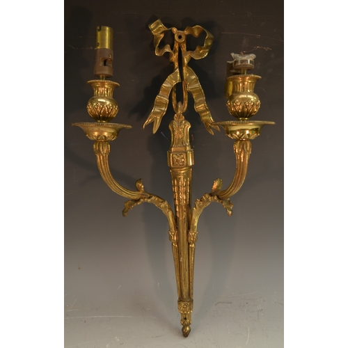 1656 - A pair of Neo-Classical design gilt metal two-light wall lights, ribbon tied, campana shaped sconces... 