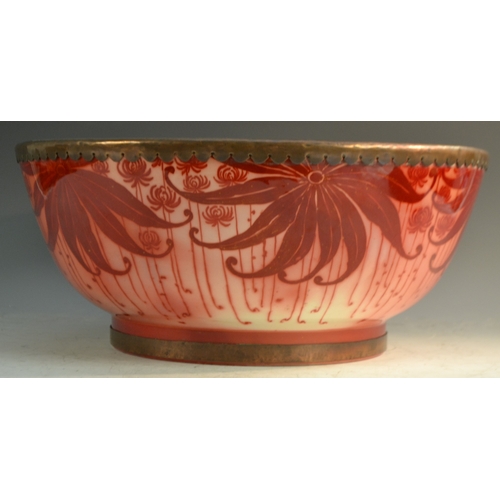 53 - A Bernard Moore red lustre punch bowl, decorated with large leaves on a red ground, metal rim, 40cm ... 