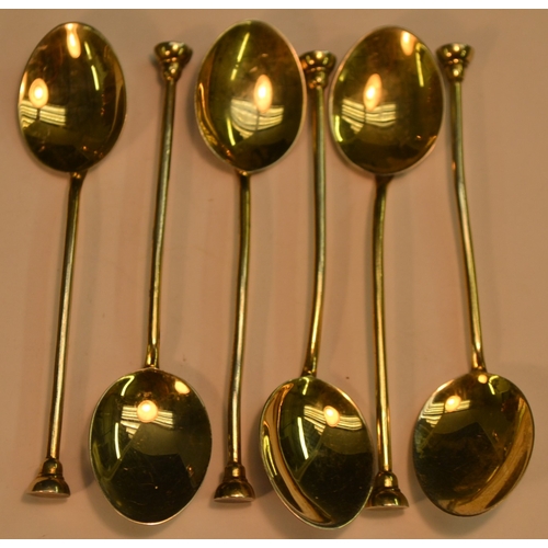 650 - A set of six Elizabeth II silver-gilt and enamel seal top coffee spoons, each bowl decorated to vers... 