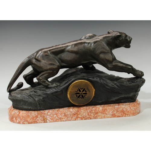 70 - An Art Deco clock, Lion on the Lookout, after Boffi, rouge marble base, 58cm wide