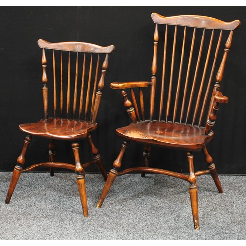 72 - A set of six elm stick-back dining chairs, of Primitive Yorkshire Windsor design, comprising a pair ... 