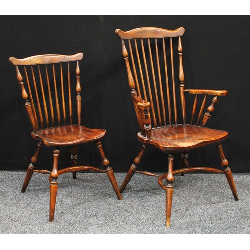 72 - A set of six elm stick-back dining chairs, of Primitive Yorkshire Windsor design, comprising a pair ... 