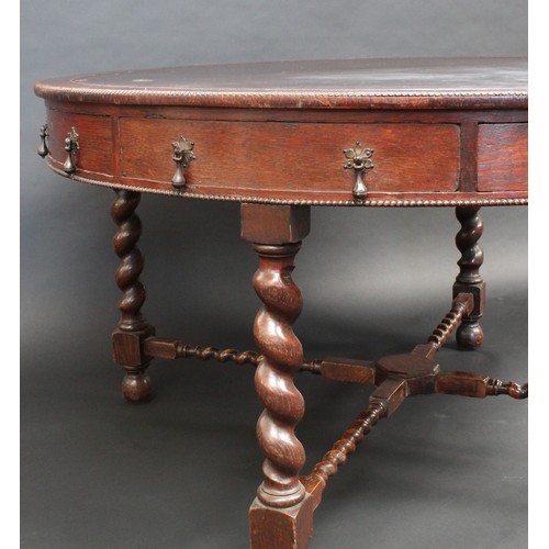 85 - An early 20th century oak library/rent table, in the Jacobean Revival taste, circular top with inset... 