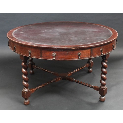 85 - An early 20th century oak library/rent table, in the Jacobean Revival taste, circular top with inset... 