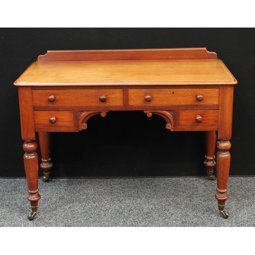 86 - A Victorian mahogany desk/dressing table, shallow half gallery, moulded slightly oversailing rectang... 