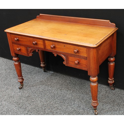 86 - A Victorian mahogany desk/dressing table, shallow half gallery, moulded slightly oversailing rectang... 