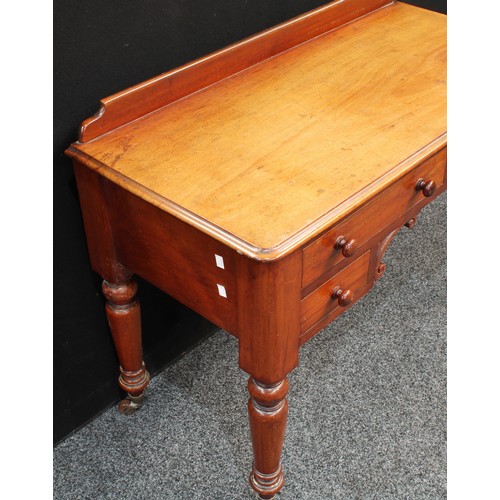 86 - A Victorian mahogany desk/dressing table, shallow half gallery, moulded slightly oversailing rectang... 