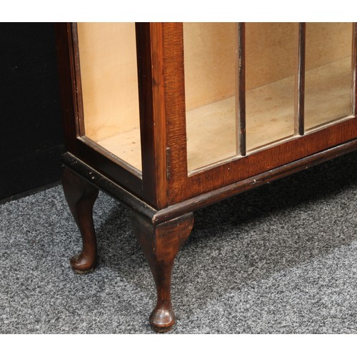 89 - An early 20th century oak display cabinet