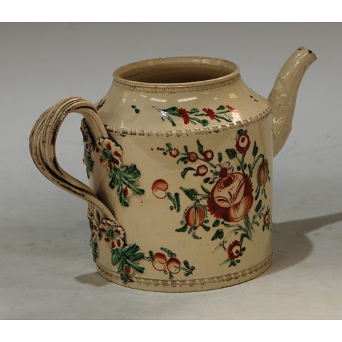 104 - An  18th century Leeds creamware cylindrical teapot, painted with stylised peonies and tulips, inter... 