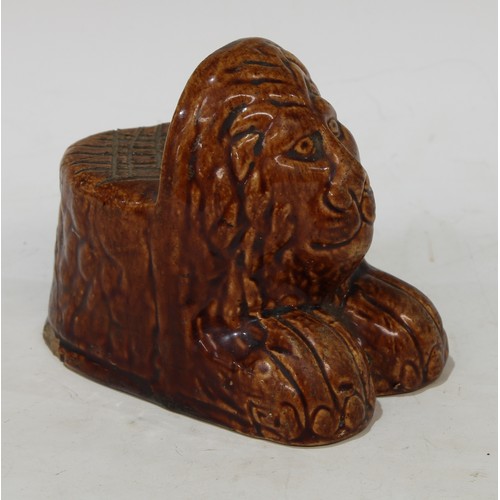 110 - An early English salt glazed stoneware lion window rest, 10cm, c.1800