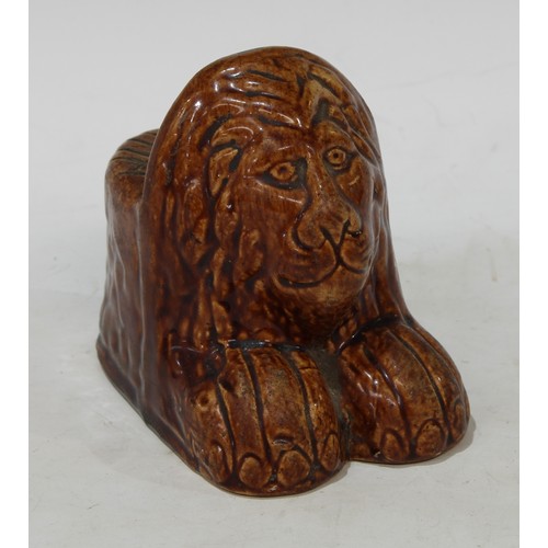 110 - An early English salt glazed stoneware lion window rest, 10cm, c.1800