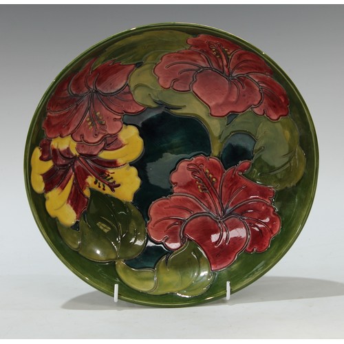 117 - A Moorcroft Hibiscus pattern fruit bowl 26.5cm diameter