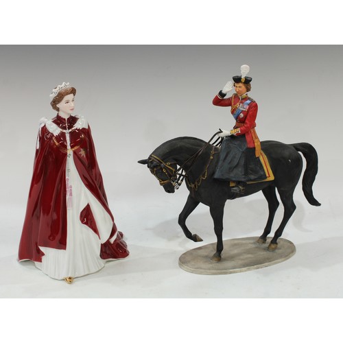 120 - A Royal Worcester figurine, Queen Elizabeth II, dressed in robes of The Order of The British Empire;... 