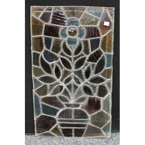 131 - An Art Nouveau stained glass panel, a vase of flowers