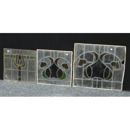 132 - A large Art Nouveau stained glass panel; two others, square, similar (3)