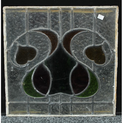 132 - A large Art Nouveau stained glass panel; two others, square, similar (3)