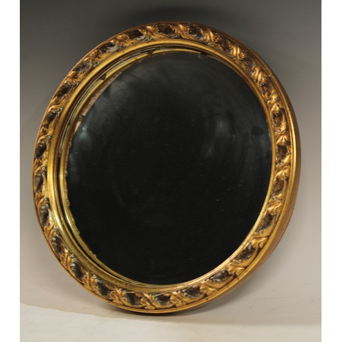 136 - A circular convex wall mirror, gold frame