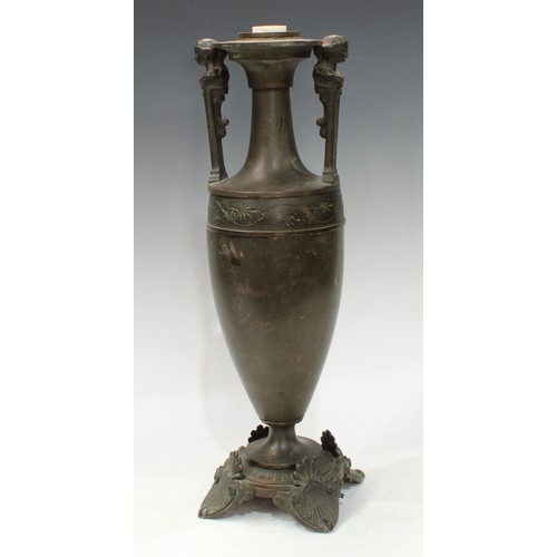 137 - A 19th century Grecian Revival brown patinated bronze table lamp, of loutrophoros form, figural hand... 