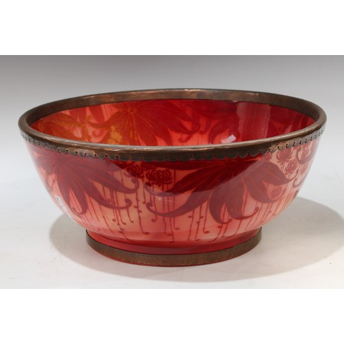 140 - A Bernard Moore red lustre punch bowl, decorated with large leaves on a red ground, metal rim, 40cm ... 