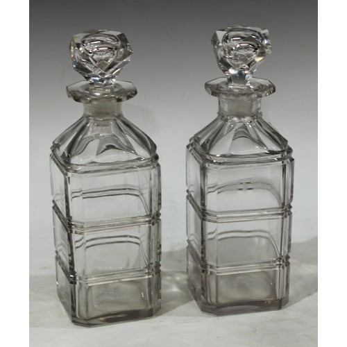 147 - A pair of 19th century glass square decanters, each fluted with girdles, panelled shoulders, prismat... 