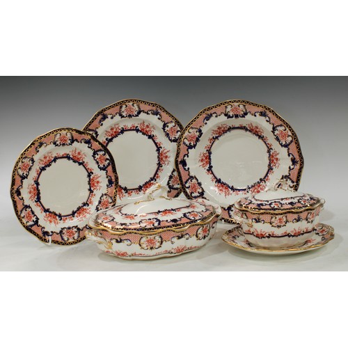 107 - An extensive Royal Crown Derby 3653 Imari dinner service, comprising meat plate with well, 55cm, eig... 