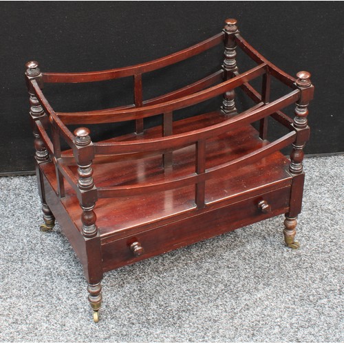 152 - A George IV mahogany Canterbury, bowed divisions, turned supports, drawer to base, brass casters, pa... 