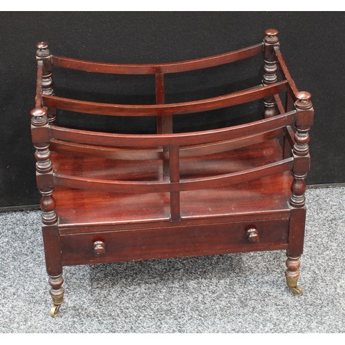 152 - A George IV mahogany Canterbury, bowed divisions, turned supports, drawer to base, brass casters, pa... 