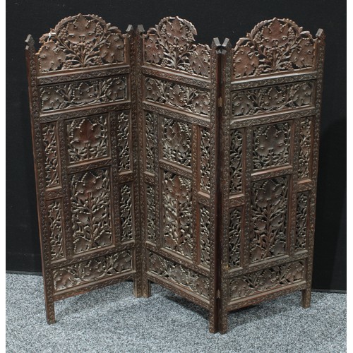 154 - A 19th century Indian carved wood three fold screen, 101cm high.