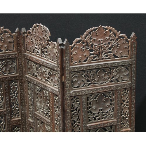 154 - A 19th century Indian carved wood three fold screen, 101cm high.