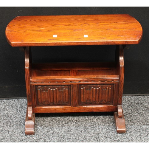 156 - An Old Charm style oak combination occasional table/magazine rack, linenfold panels. 51.5cm high