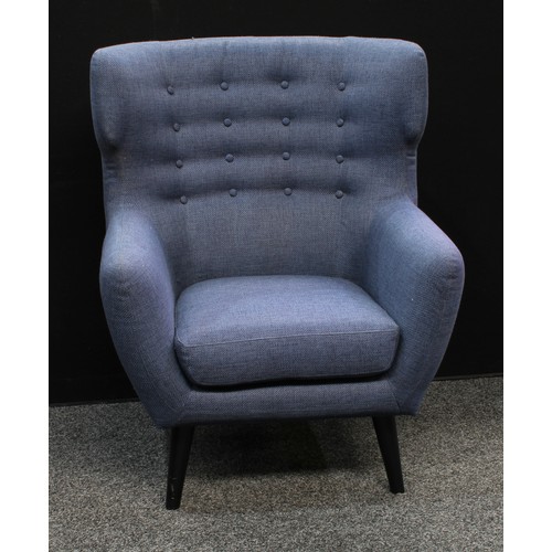 157 - A retro style wingback armchair, shallow button back, tapered cylindrical legs, 104.5cm high