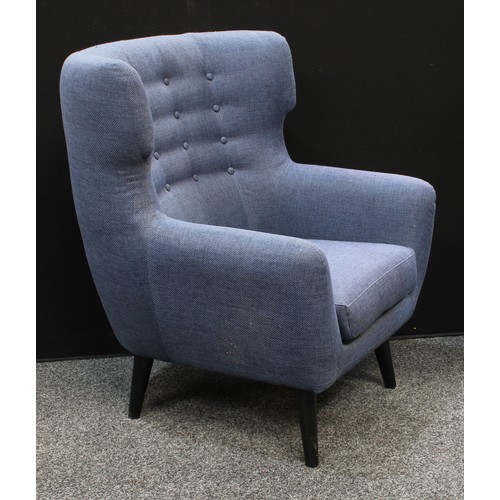 157 - A retro style wingback armchair, shallow button back, tapered cylindrical legs, 104.5cm high