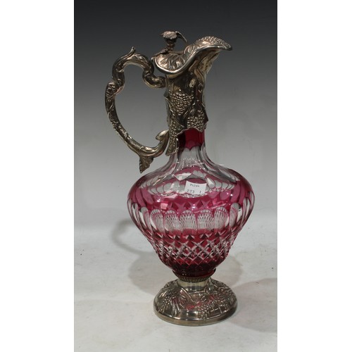 143 - A 20th century silver and cranberry cut glass claret jug, hallmarked silver collar and base embossed... 