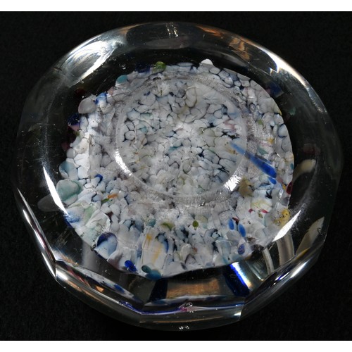 5175 - A late Victorian glass paperweight, the domed top enclosing a colourful Nailsea pad, centred by the ... 