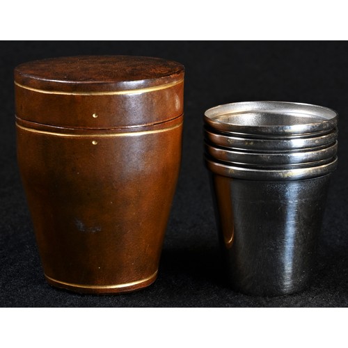 5193 - A nest of four EPNS stacking cups, of small proportions, gilt-tooled Florentine brown leather case, ... 