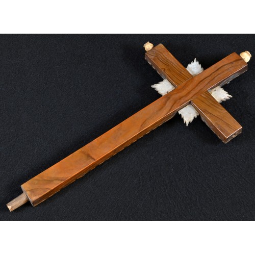 5185 - A Middle Eastern olive wood, mother of pearl and marquetry corpus christi, the cross inlaid with the... 