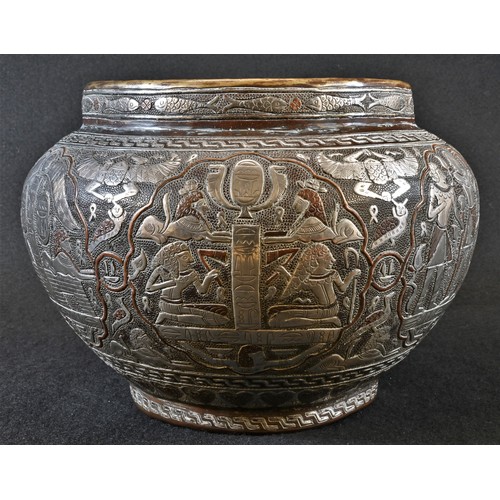 5184 - A Middle Eastern Cairo ware ovoid jardiniere, profusely damascened with Egyptian figures and devices... 