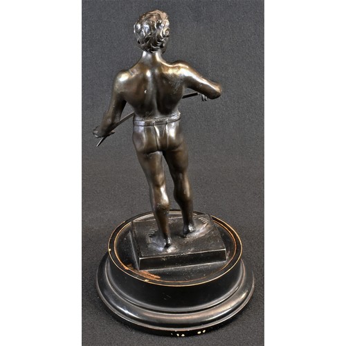 5307 - An Art Deco brown patinated library sculpture, of a warrior holding his blade, ebonised trophy plint... 